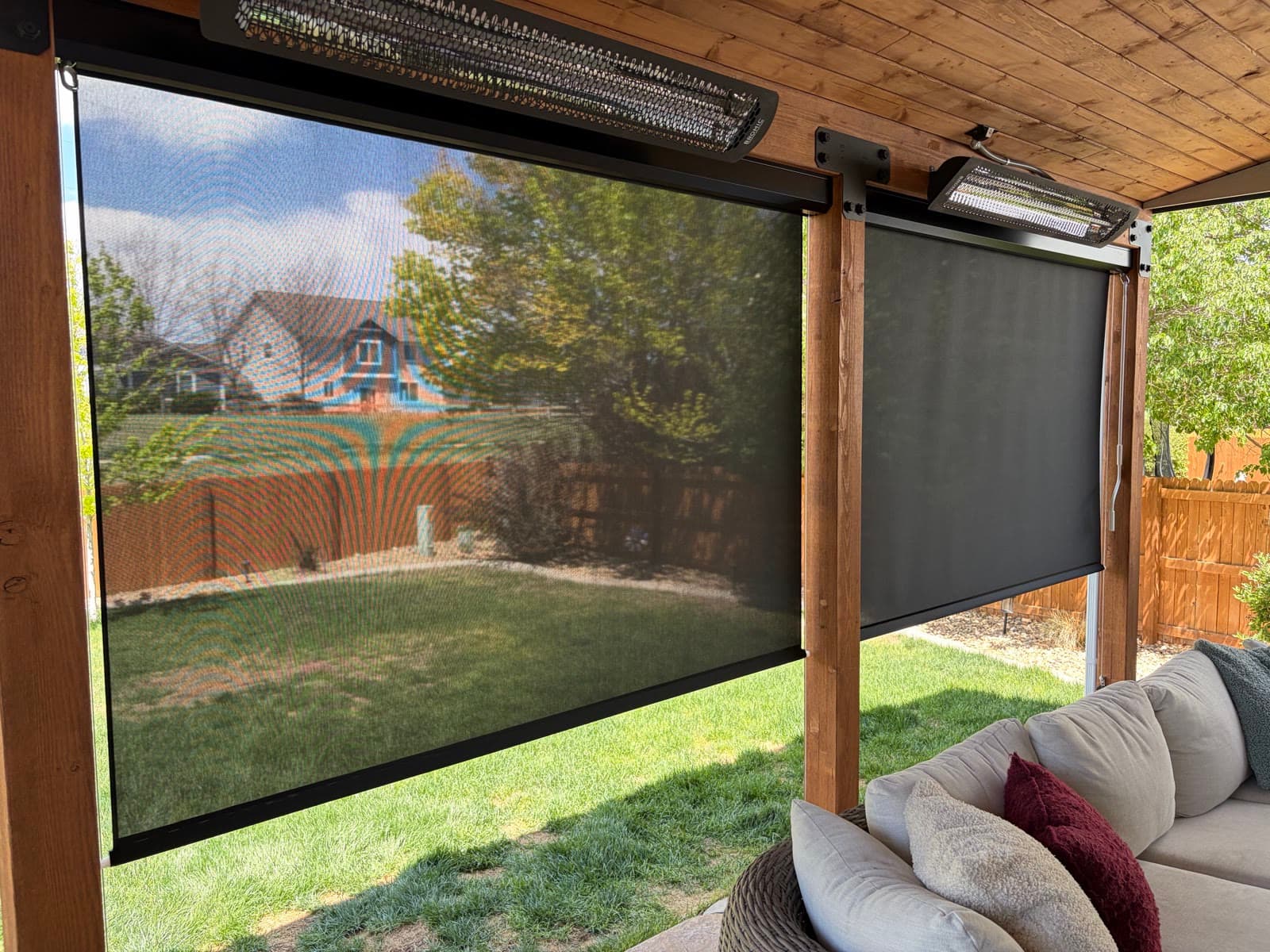 Exterior solar screens shading a pergola seating area from afternoon sun