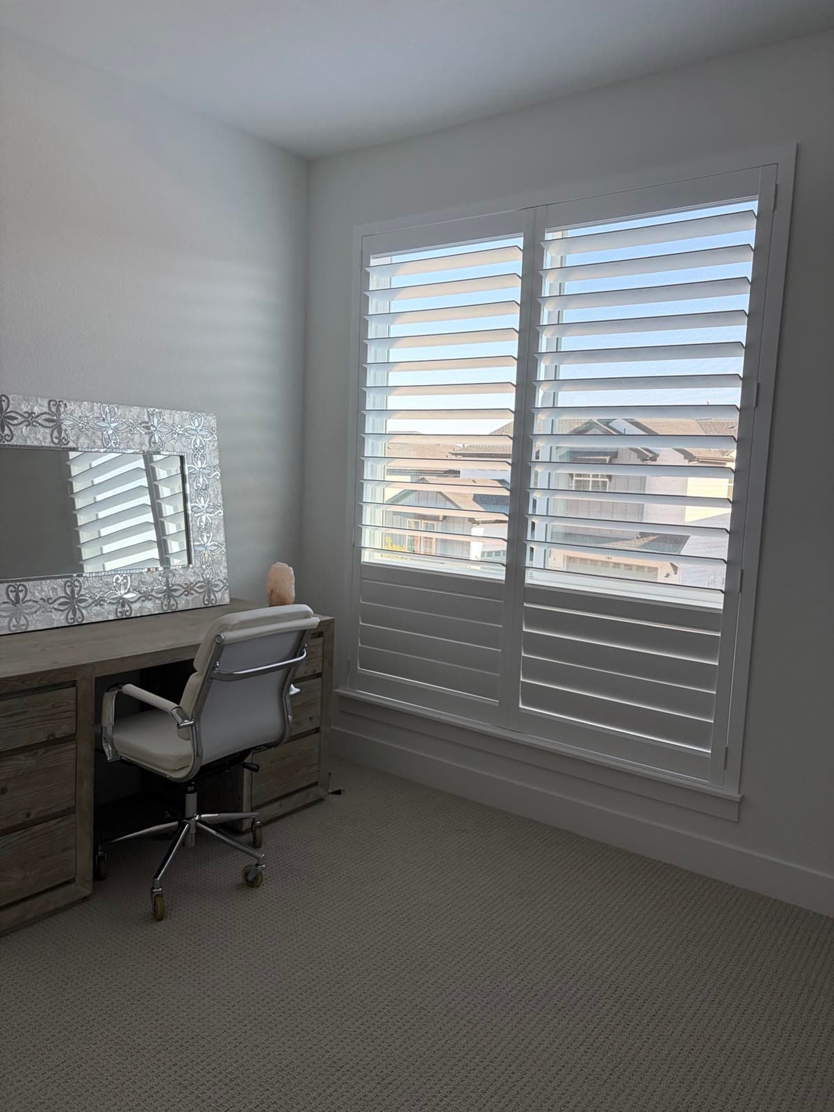 NewStyle® shutters with louvers open in the home office