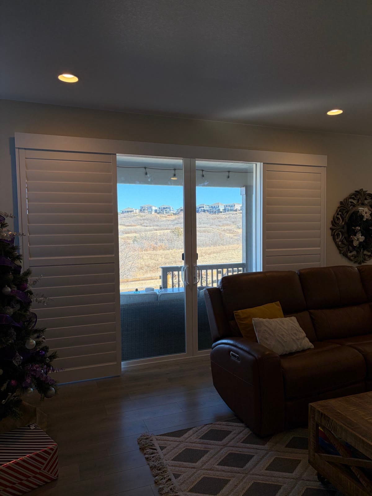 The same patio-door shutters slid open to the deck and Colorado hills